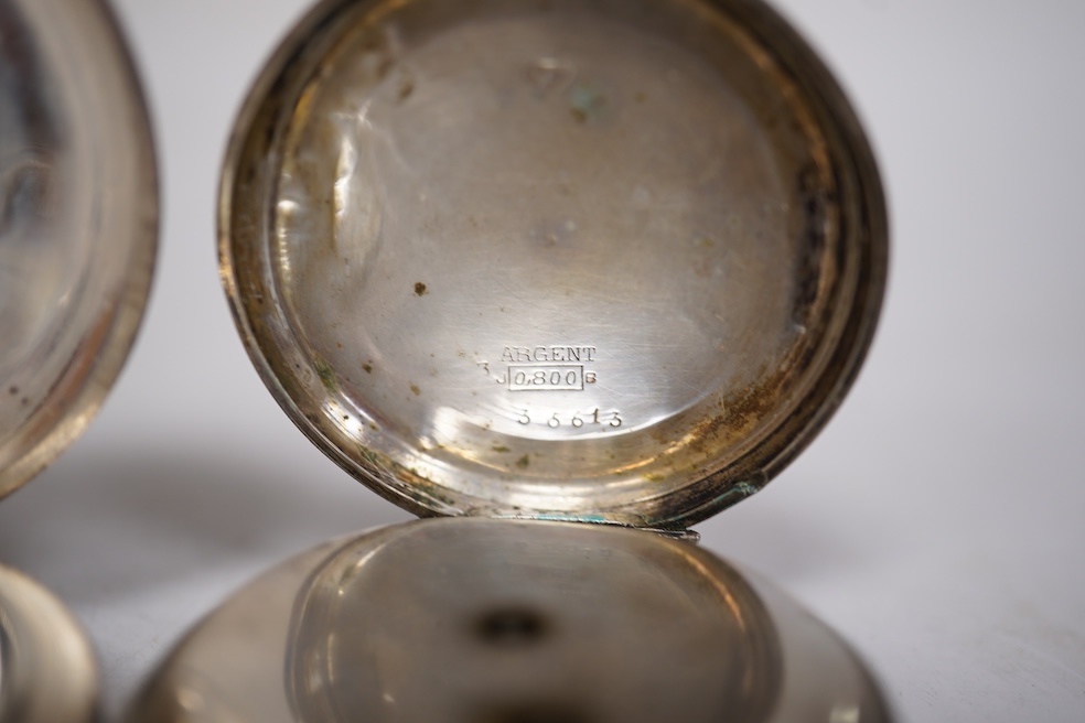 Three early to mid 20th century silver open faced pocket watches, with Roman or Arabic dials and subsidiary seconds, including two keyless and one key wind (Admiral Tacy Watch Co), together with one smaller silver open f